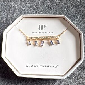 Radiant Gold and Sapphire Necklace with Intricate Detailing